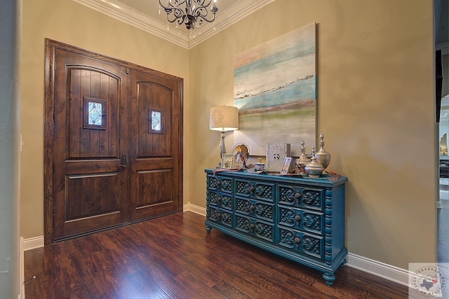 foyer with a notable chandelier, crown molding, and dark hardwood / wood-style floors