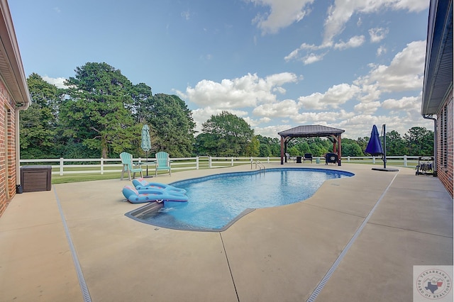 view of pool featuring a gazebo and a patio