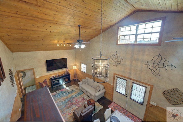 living room featuring wood ceiling, a wood stove, high vaulted ceiling, and french doors