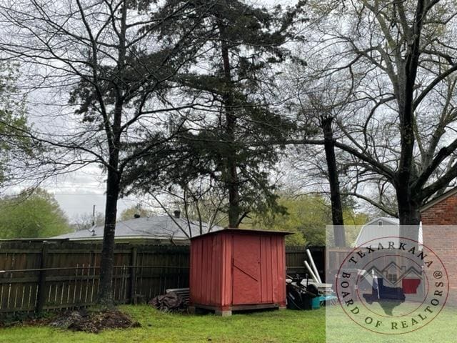 view of outbuilding with a yard