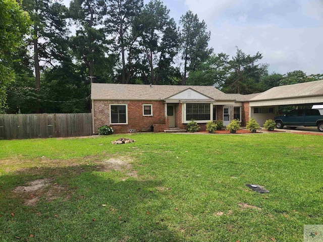 single story home with a carport and a front lawn