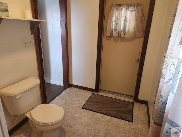 bathroom with toilet and walk in shower