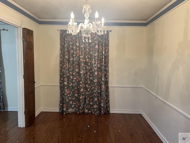 unfurnished dining area featuring a textured ceiling, a notable chandelier, and dark hardwood / wood-style flooring