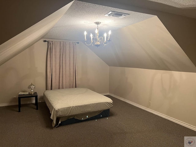 carpeted bedroom featuring a chandelier, a textured ceiling, and lofted ceiling