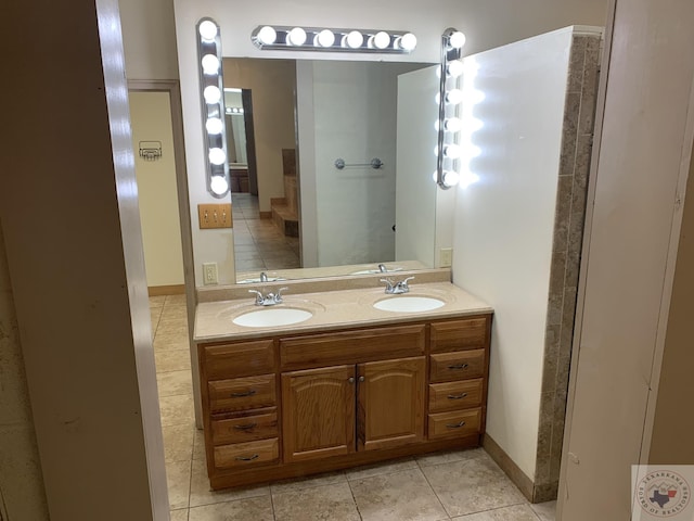 bathroom with vanity and tile patterned flooring