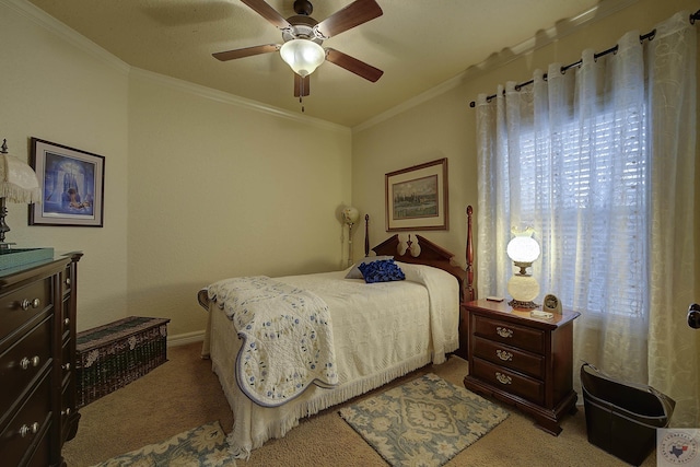 carpeted bedroom featuring ceiling fan and ornamental molding