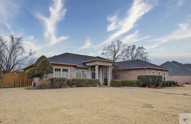 view of front of property with a front lawn