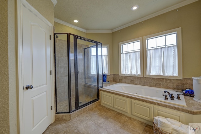 bathroom with tile patterned floors, crown molding, a textured ceiling, and plus walk in shower