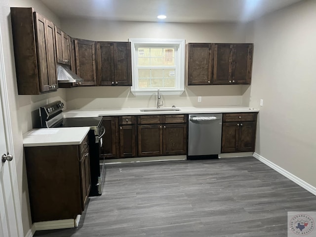 kitchen featuring dark brown cabinets, stainless steel dishwasher, range with electric stovetop, sink, and light hardwood / wood-style floors