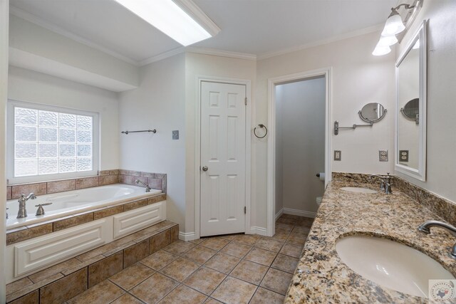 bathroom with ornamental molding, a closet, tile patterned flooring, and a sink