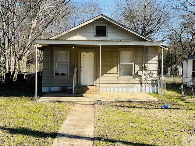 bungalow-style home featuring a front yard