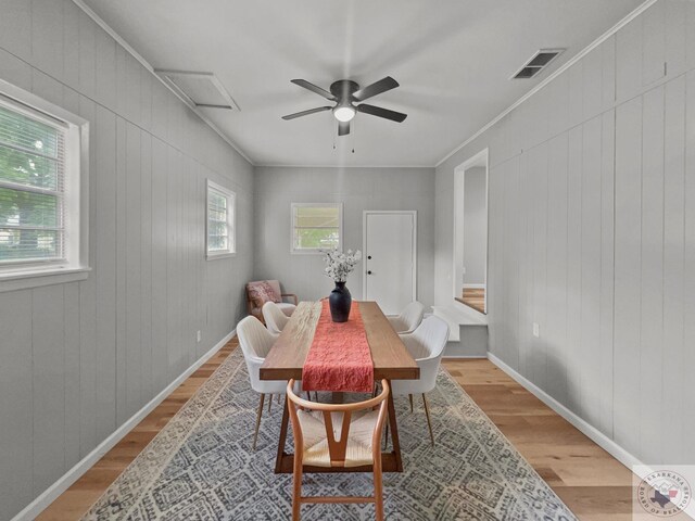 dining room with ceiling fan, light hardwood / wood-style flooring, and ornamental molding