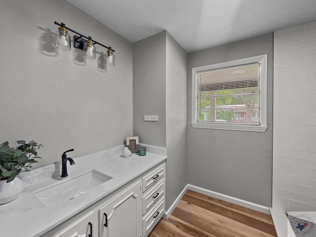 bathroom featuring hardwood / wood-style floors and vanity