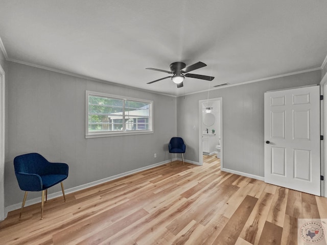 interior space with crown molding, light hardwood / wood-style floors, and ceiling fan