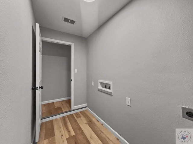 laundry room with washer hookup, hardwood / wood-style flooring, and hookup for an electric dryer