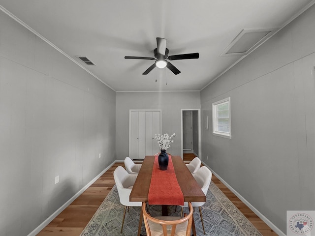 dining space featuring hardwood / wood-style flooring, ceiling fan, and ornamental molding