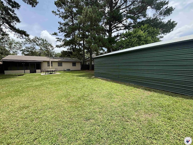 3703 Hickory St, Texarkana, AR 71854 - view of green lawn with a sunroom