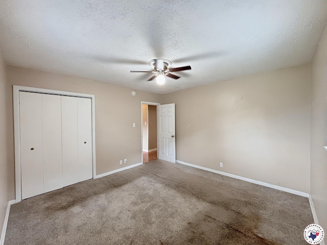 3703 Hickory St, Texarkana, AR 71854 - unfurnished bedroom with a closet, carpet flooring, a textured ceiling, and a ceiling fan
