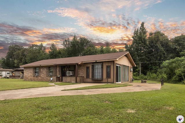203 Pleasant Vly, Texarkana, AR 71854 - view of front of house with a front lawn, concrete driveway, cooling unit, and brick siding