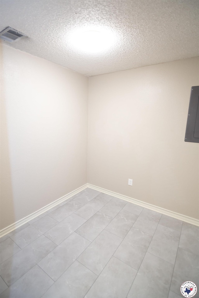 4718 Charleston St, Texarkana, AR 71854 - unfurnished room featuring electric panel, a textured ceiling, and baseboards