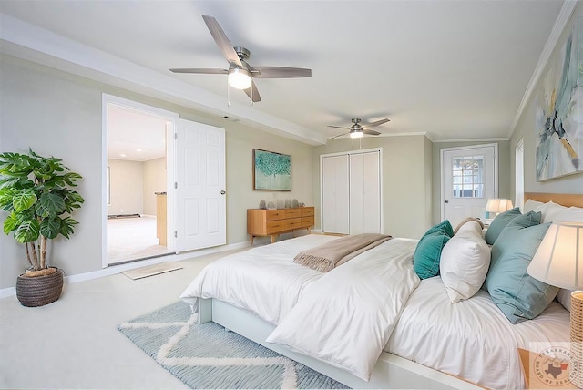 bedroom featuring crown molding, carpet flooring, a closet, and ceiling fan