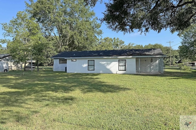 view of outbuilding featuring a yard