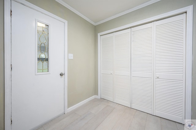 interior space featuring crown molding and light hardwood / wood-style floors