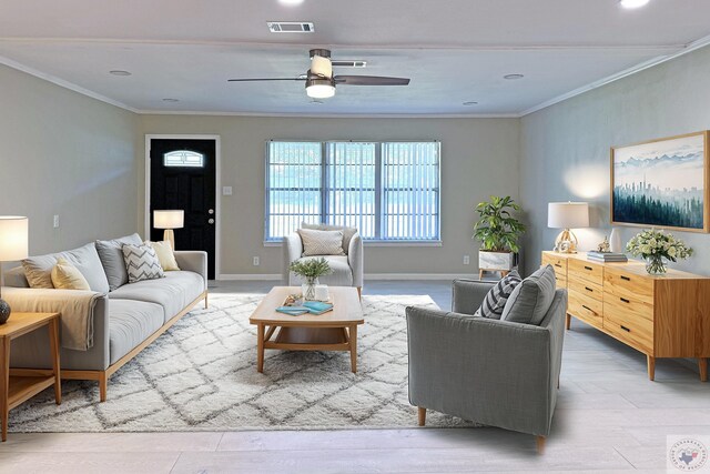 living room featuring ceiling fan, ornamental molding, and light hardwood / wood-style floors