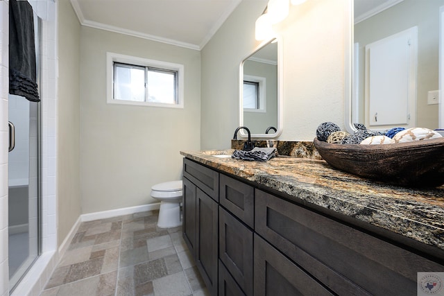 bathroom featuring an enclosed shower, vanity, and ornamental molding