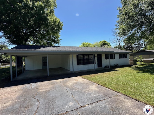 112 Maryland Dr, Texarkana, TX 75501 - view of front of property with aphalt driveway, a carport, and a front lawn