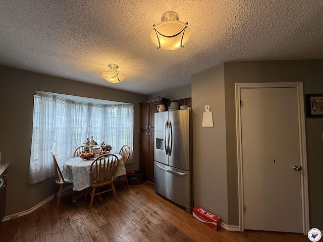 567 Mc 257, Texarkana, AR 71854 - dining room featuring light wood-style flooring and a textured ceiling