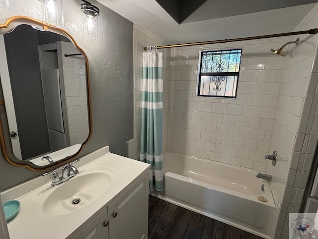 bathroom featuring vanity, hardwood / wood-style flooring, and shower / bath combination with curtain