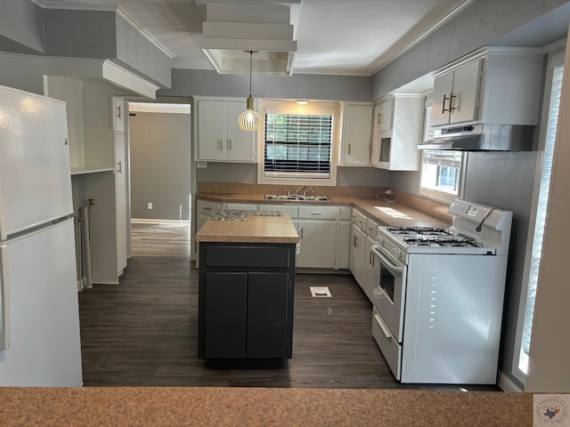 kitchen with decorative light fixtures, white appliances, white cabinetry, and a center island