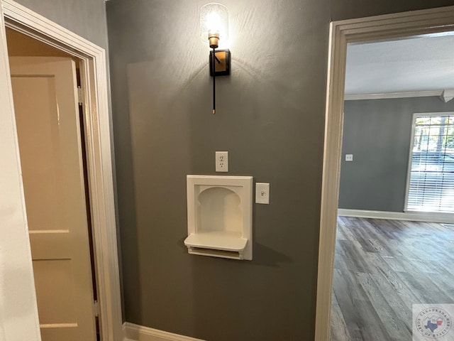 interior space featuring hardwood / wood-style flooring and ornamental molding