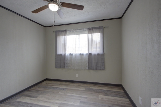 spare room featuring ceiling fan, light hardwood / wood-style flooring, a textured ceiling, and crown molding