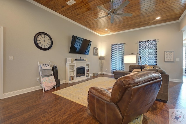 living room with a glass covered fireplace, dark wood-style flooring, ornamental molding, and wooden ceiling