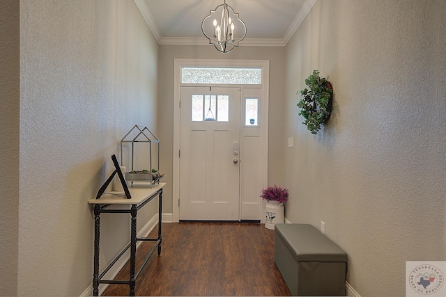 entryway featuring a notable chandelier, dark wood finished floors, crown molding, and a textured wall