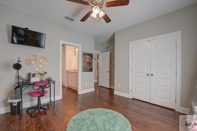 80 Chester Field Cir, Texarkana, TX 75503 - bedroom featuring dark wood-type flooring, a closet, baseboards, a ceiling fan, and ensuite bath