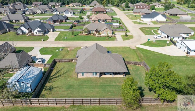 birds eye view of property with a residential view