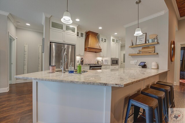 kitchen featuring ornamental molding, open shelves, dark wood finished floors, appliances with stainless steel finishes, and custom exhaust hood