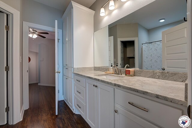 80 Chester Field Cir, Texarkana, TX 75503 - bathroom featuring vanity, a ceiling fan, wood finished floors, baseboards, and curtained shower