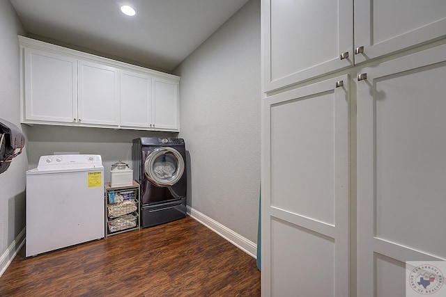 clothes washing area featuring baseboards, washing machine and clothes dryer, dark wood finished floors, recessed lighting, and cabinet space