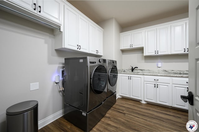 3401 Skyline Blvd, Texarkana, TX 75503 - washroom featuring washing machine and clothes dryer, dark wood-type flooring, cabinet space, and baseboards