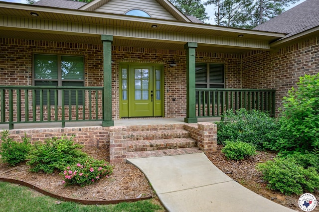 3401 Skyline Blvd, Texarkana, TX 75503 - doorway to property with brick siding, a porch, and roof with shingles