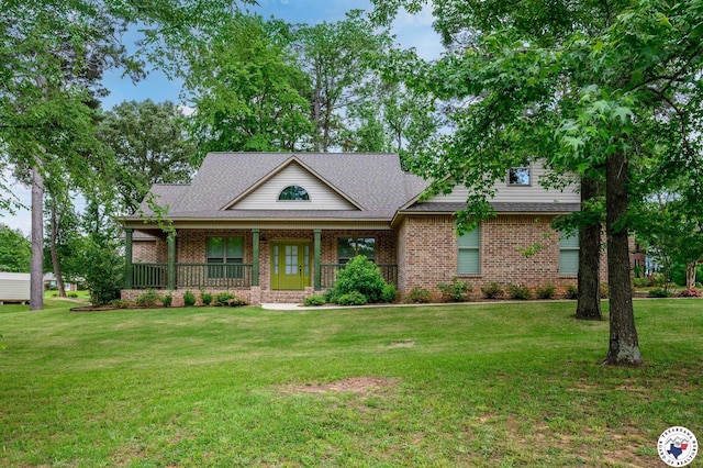 3401 Skyline Blvd, Texarkana, TX 75503 - view of front of home featuring brick siding, a front yard, a porch, and a shingled roof