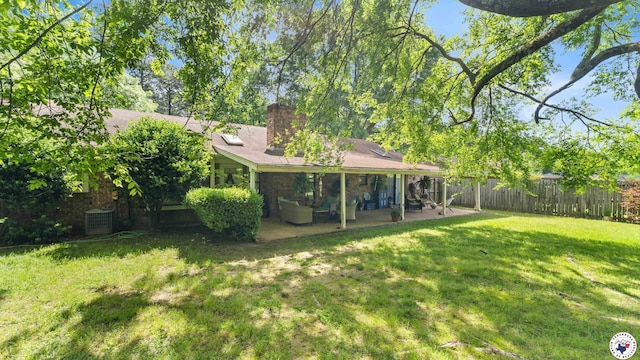 6209 N Park Rd, Texarkana, TX 75503 - view of yard with central AC, fence, and a patio
