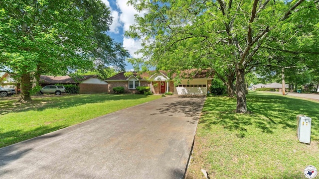 6209 N Park Rd, Texarkana, TX 75503 - view of front of property with aphalt driveway, a garage, and a front yard