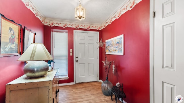 6209 N Park Rd, Texarkana, TX 75503 - foyer with light wood-type flooring, baseboards, and ornamental molding