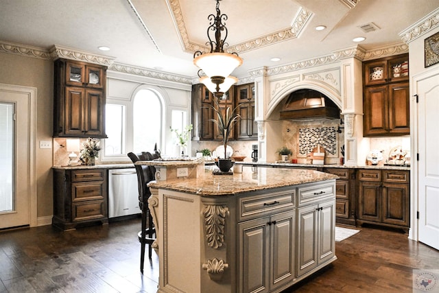 kitchen with a center island, tasteful backsplash, dishwasher, decorative light fixtures, and dark hardwood / wood-style floors