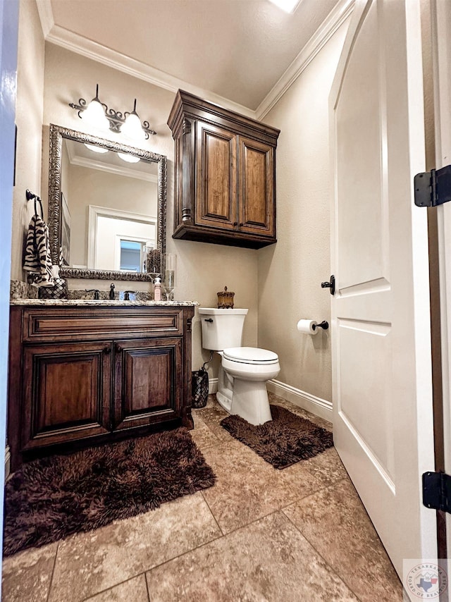 bathroom with crown molding, toilet, and vanity